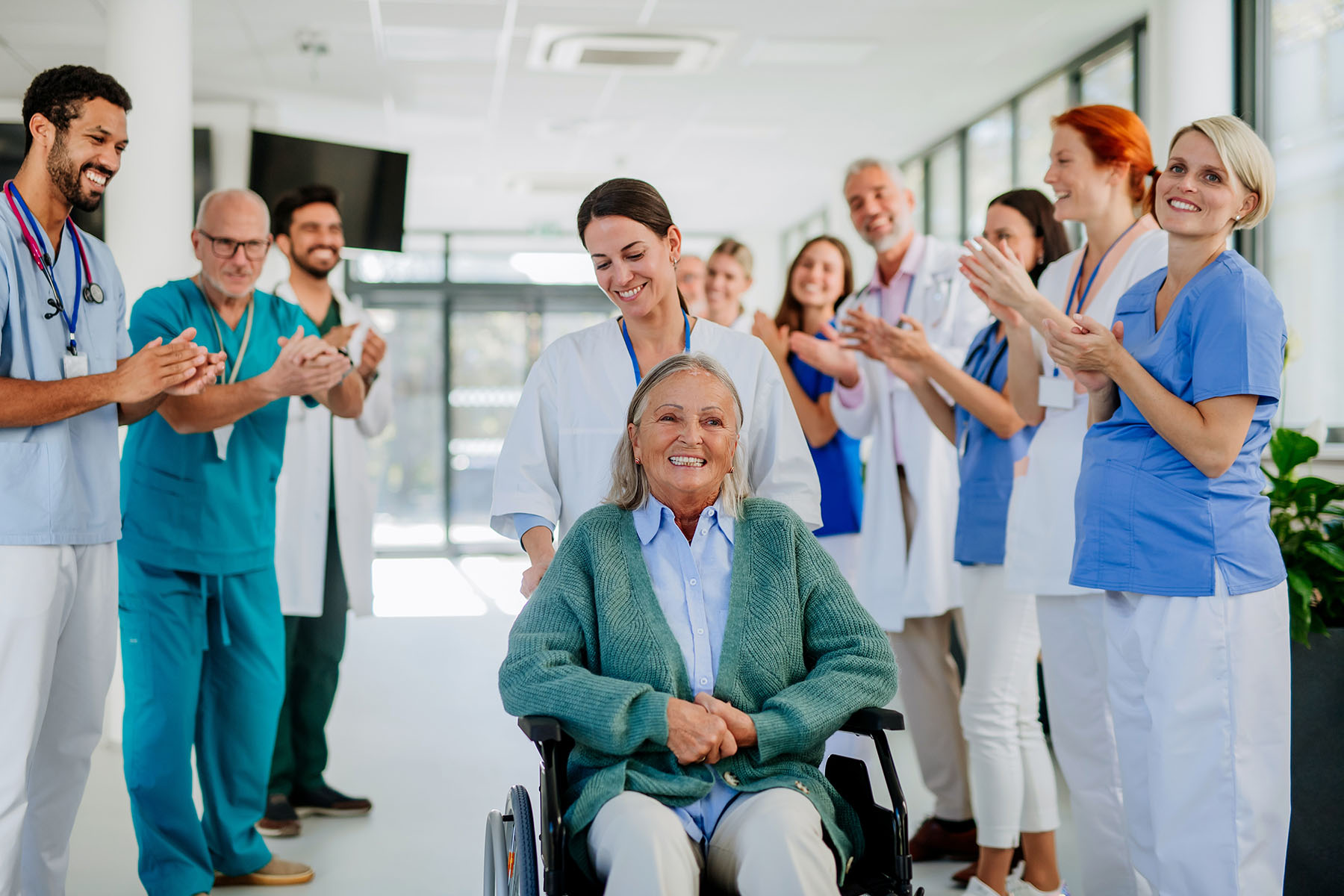 HCPs applauding a patient