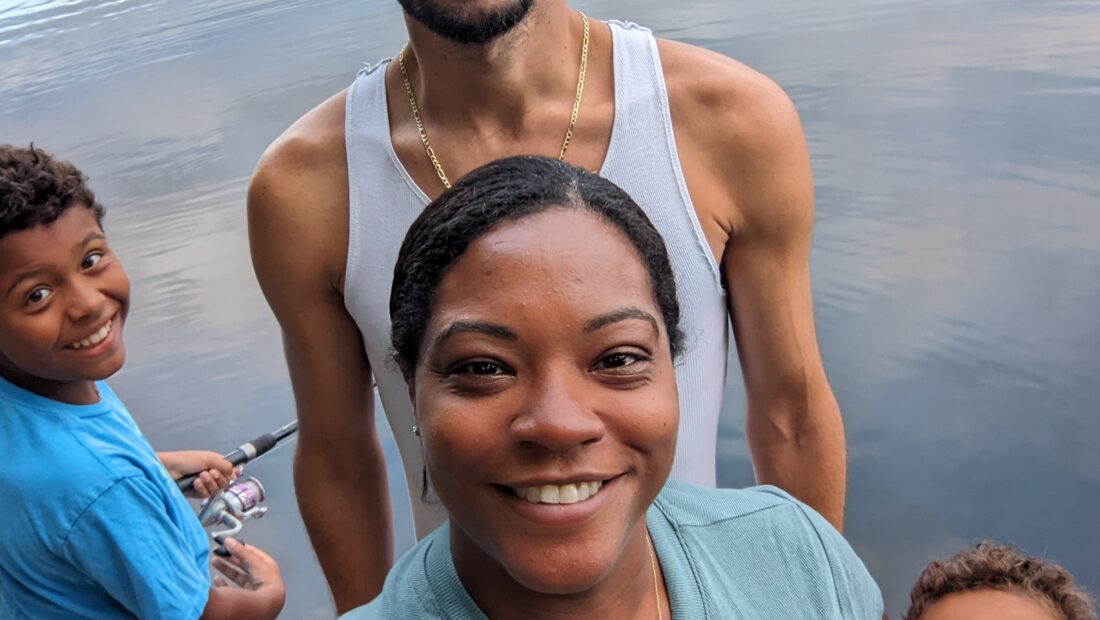 Nia Maya James with husband and two sons at the lake