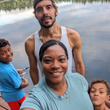 Nia Maya James with husband and two sons at the lake