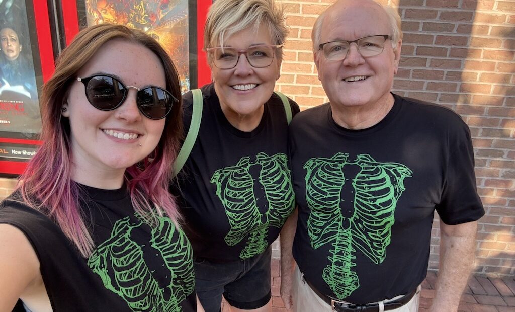 Carrie Smith and two family members in novelty t-shirts