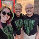 Carrie Smith and two family members in novelty t-shirts
