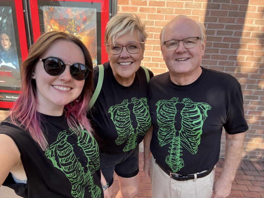 Carrie Smith and two family members in novelty t-shirts